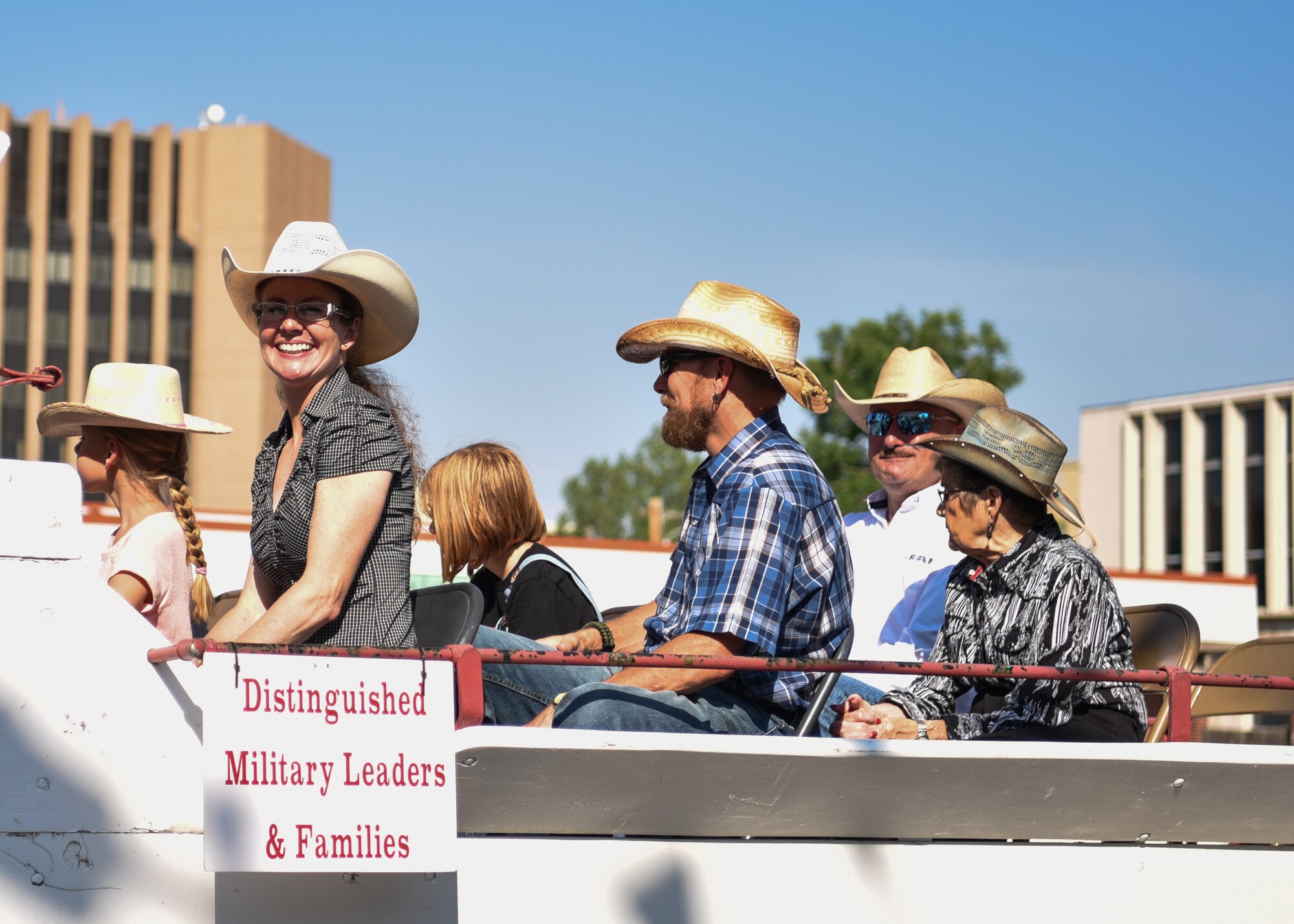 Col. Stacy Jo Huser, 90th Missile Wing commander, smiles/waves at the crowd during the 122nd Cheyenne Frontier Days opening Grand Parade in Cheyenne, Wyo., July 21, 2018. Air Force leadership is honored to participate in the parade to show their support to the community. The F.E. Warren Air Force Base and Cheyenne communities came together to celebrate the CFD rodeo and festival, which runs from July 20-29. (U.S. Air Force photo by Airman 1st Class Braydon Williams)