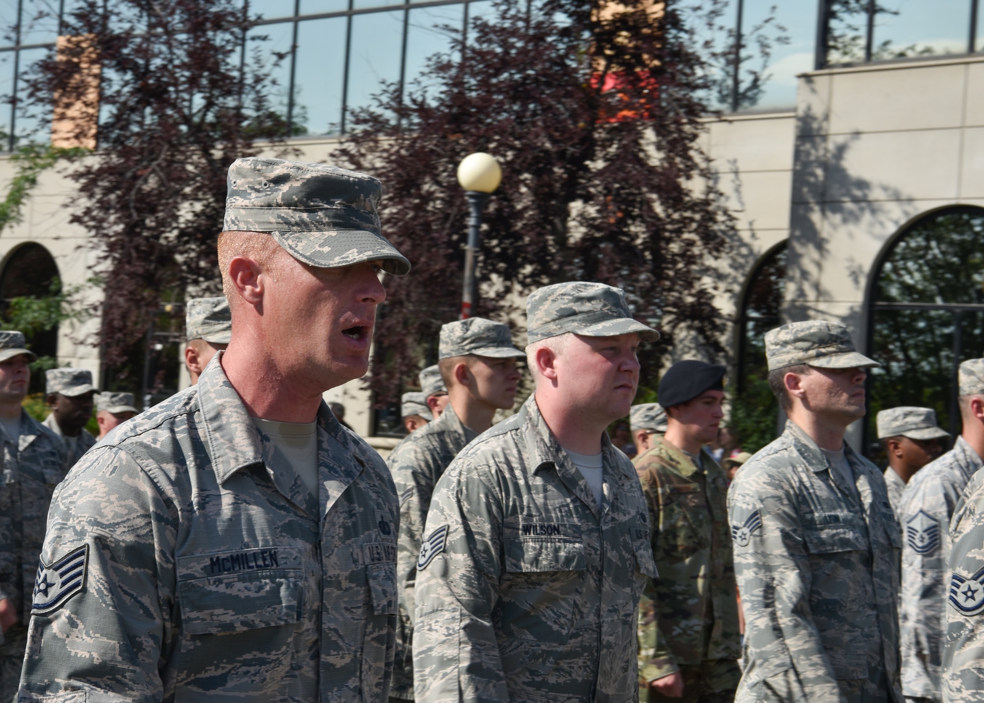 Staff Sgt. Michael McMillen, 90th Force Support Squadron fitness assessment cell manager, calls cadence for a flight of approximately 150 Airmen during the Grand Parade in Cheyenne, Wyo., July 21, 2018. The Grand Parade is part of the official kick-of event starting Cheyenne Frontier Days, the Daddy of ‘em All. The F.E. Warren Air Force Base and Cheyenne communities came together to celebrate the CFD rodeo and festival, which runs from July 20-29. (U.S. Air Force photo by Airman 1st Class Braydon Williams)