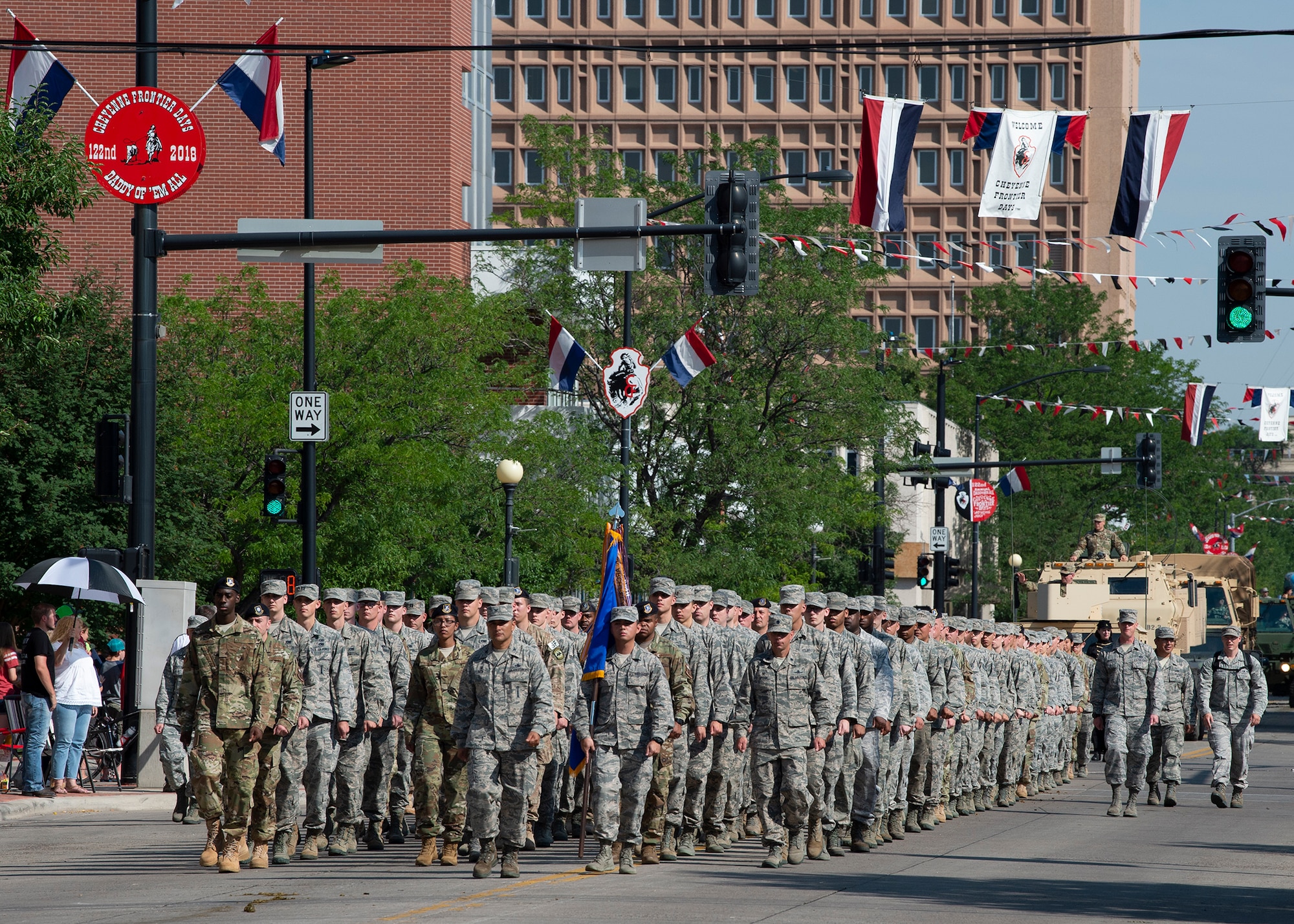 Airmen from F.E. Warren Air Force Base, Wyo., march in formation during the 122nd Cheyenne Frontier Days opening Grand Parade in Cheyenne, Wyo., July 21, 2018. Service members from multiple branches took part in the parade. This year marks the 151st anniversary of F.E. Warren Air Force Base and the city of Cheyenne. The F.E. Warren Air Force Base and Cheyenne communities came together to celebrate the CFD rodeo and festival, which runs from July 20-29. (U.S. Air Force photo by Tech Sgt. Christopher Ruano)