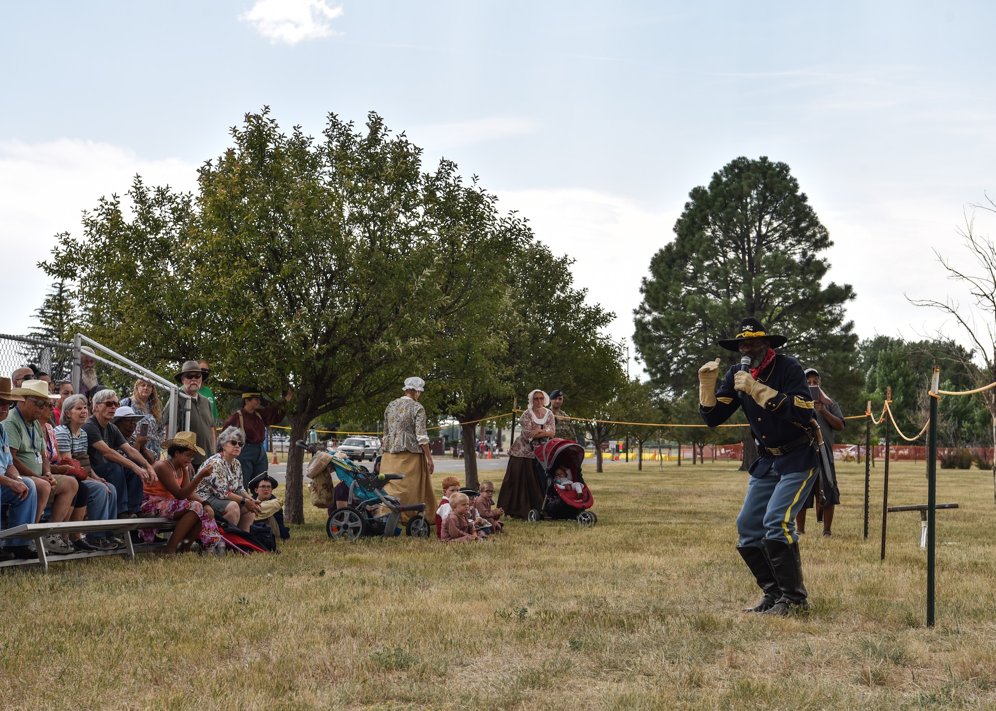 Fred Applewhite a Buffalo Soldier re-enactor talks to the audience about the history of the Buffalo Soldier’s during Fort D.A. Russell Days on F.E. Warren Air Force Base, Wyo., July 21, 2018. The performance is a demonstration of historical cavalry precision riding drills. The annual open house brings military and civilian communities together to learn more about the base's rich history. (U.S. Air Force photo by Airman 1st Class Braydon Williams)