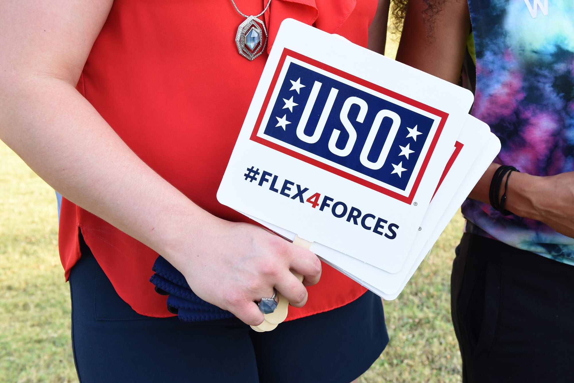 Incirlik Air Base USO members and U.S. Air Force volunteers hand out USO merchandise during the 4th of July celebration at Incirlik Air Base, Turkey, July 4, 2018.