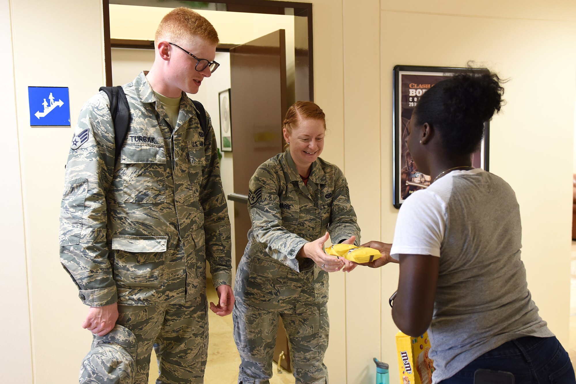 U.S. Air Force Airman 1st Class Valtrice Sullivan, 39th Security Forces Squadron contingency deployer and USO volunteer, hands out ice cream to Airmen at Incirlik Air Base, Turkey, July 13, 2018.