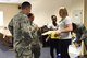 Lisa Wease, USO center manager (right), and U.S. Air Force Airman 1st Class Valtrice Sullivan, 39th Security Forces Squadron contingency deployer and USO volunteer (center), hand out ice cream at Incirlik Air Base, Turkey, July 13, 2018.