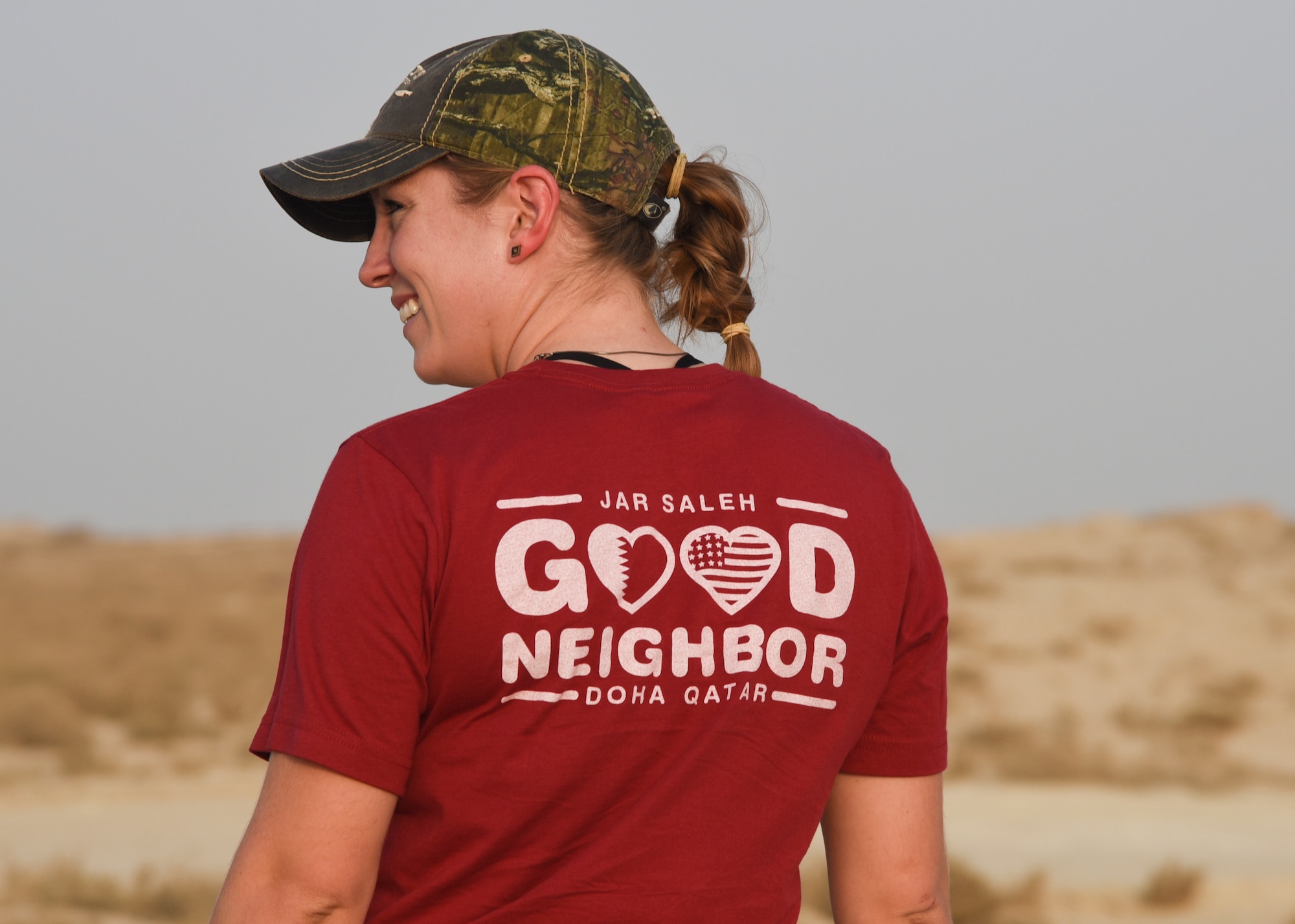 Staff Sgt. Brittani McClure, president of Jar Saleh, a volunteer organization at Al Udeid Air Base, waits for other volunteers during a trip to clean up beaches in Doha, Qatar, July 6, 2018. Jar Saleh works alongside the host nation’s community groups to continue a good-faith relationship through acts of kindness and generosity. (U.S. Air Force photo by Staff Sgt. Enjoli Saunders)