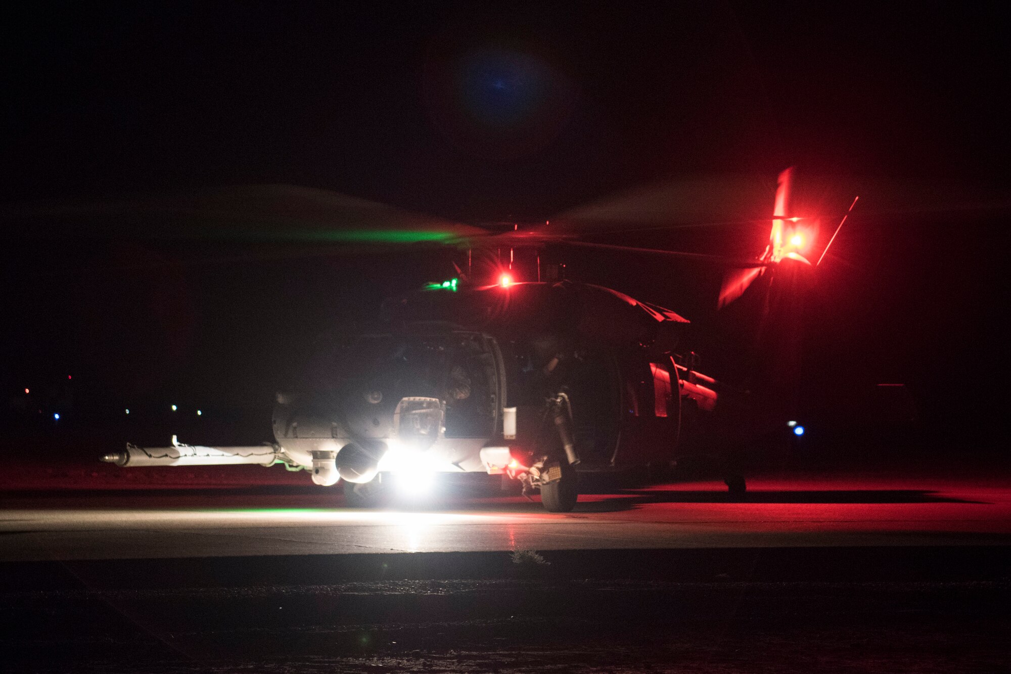 An HH-60 Pave Hawk takes off for a nighttime flight, July 4, 2018, at Al Asad Air Base, Iraq.