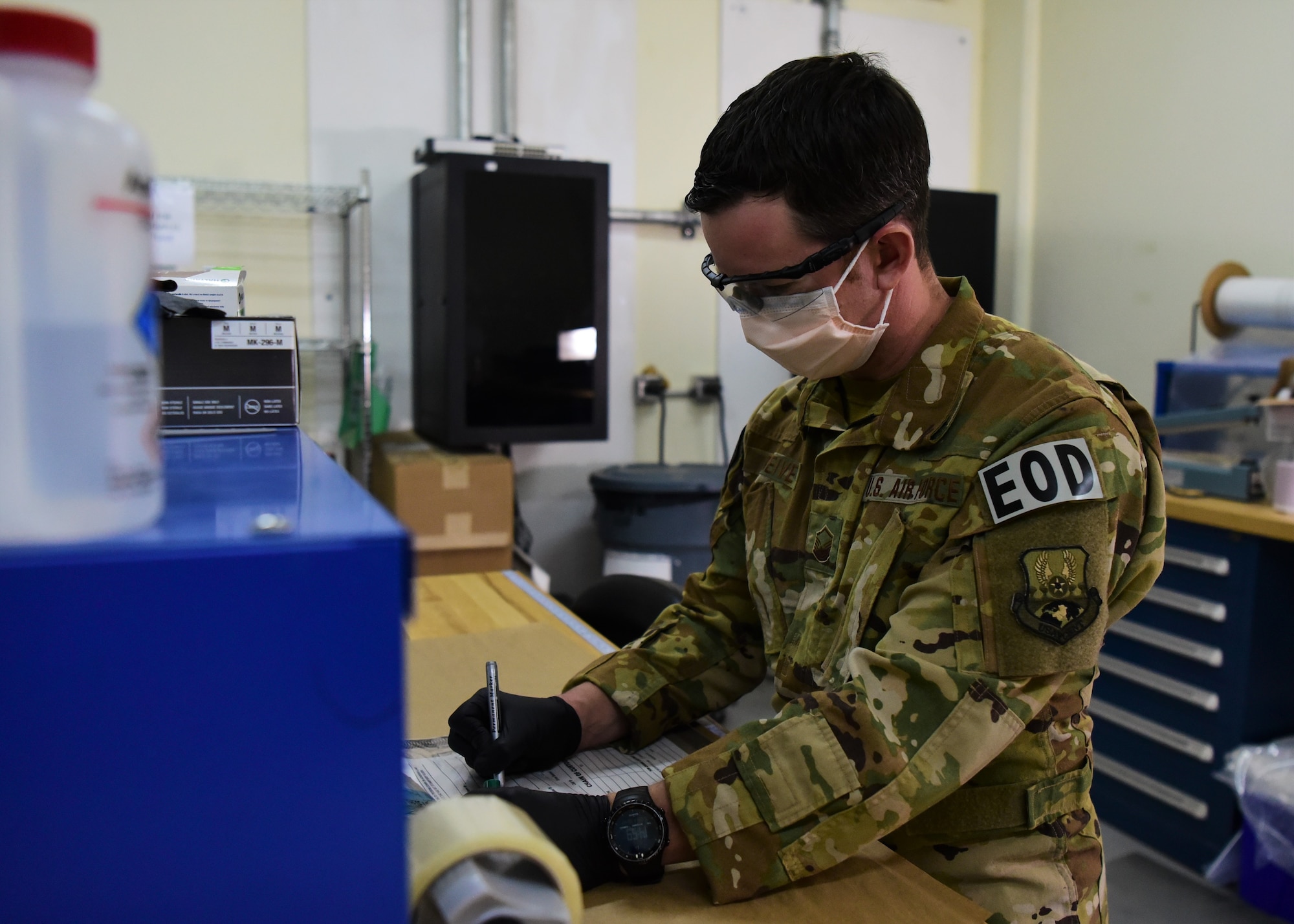 Master Sgt. Michael Breive, Forensic Exploitation Laboratory – CENTCOM non-commissioned officer in charge, prepares to photograph a piece of evidence June 27, 2018 at the FXL-C lab, located on Camp Arifjan, Kuwait. Breive is the sole Airman at the FXL-C office, serving in a joint expeditionary tasked and individual augmentee role. (U.S. Air Force photo by Staff Sgt. Christopher Stoltz)