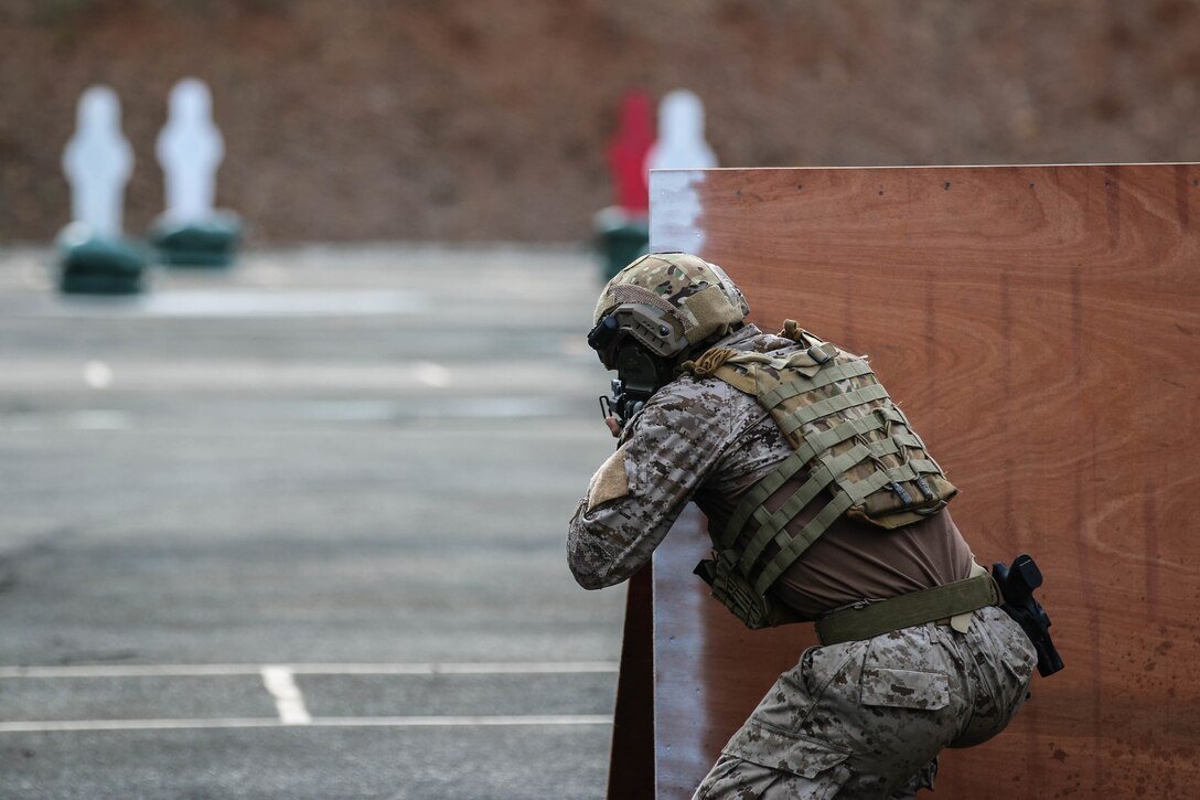 A shooter with team Chile aims at his first target in the second day of the assault event