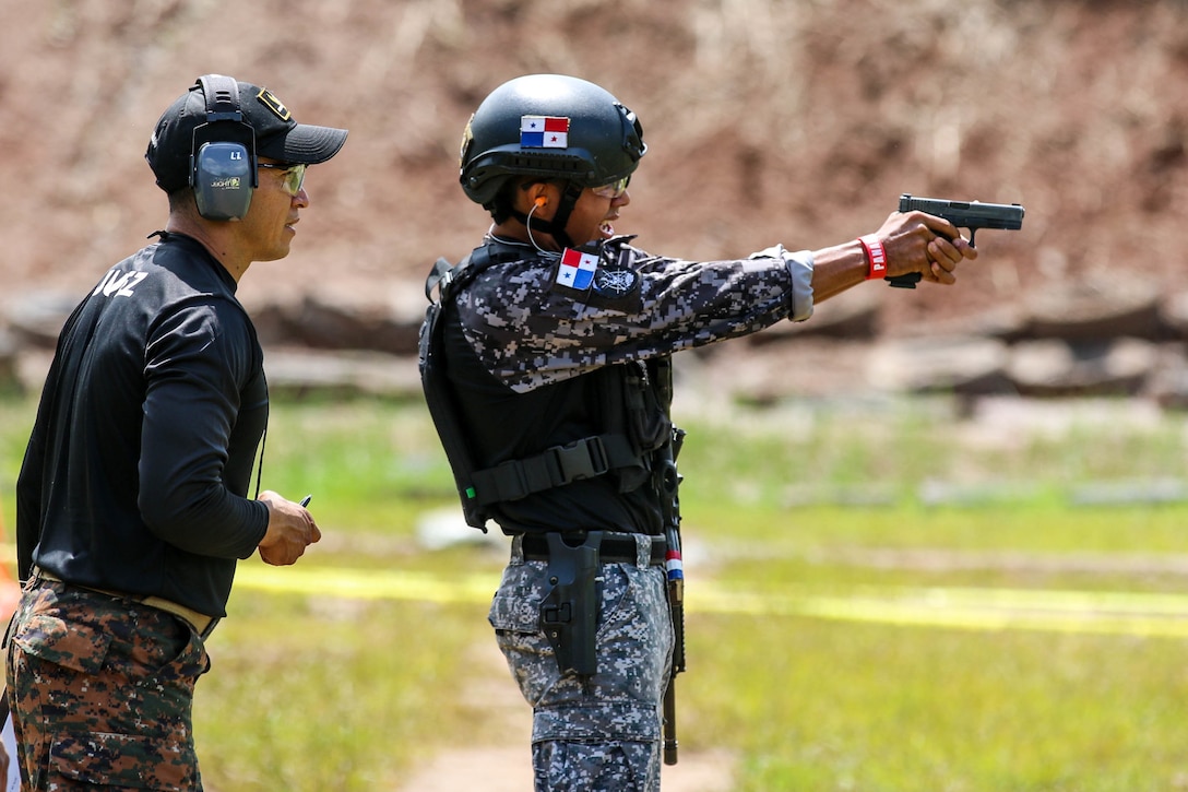 A shooter from team Panama team aims at his target in the assault event