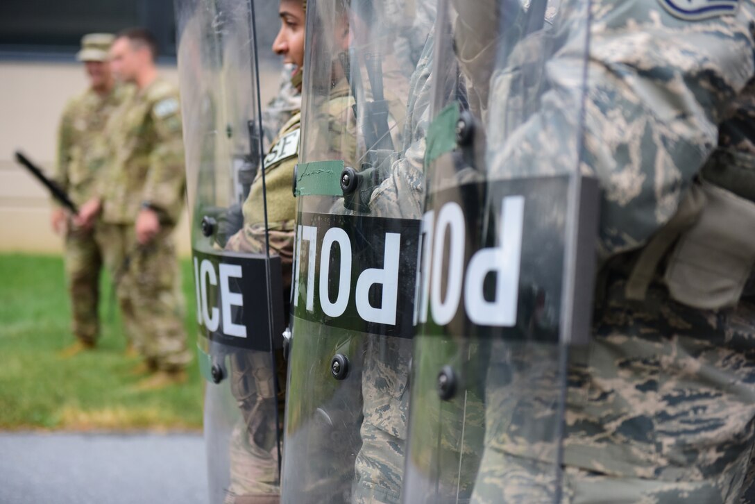 Security forces specialists from the 193rd Special Operations Security Forces Squadron, Middletown, Pennsylvania, Pennsylvania Air National Guard, conduct riot control countermeasures July 22, 2018. The 193rd SOSFS Airmen participate in this two times a year as part of their required domestic operations training. (U.S. Air National Guard photo by Senior Airman Rachel Loftis/Released)