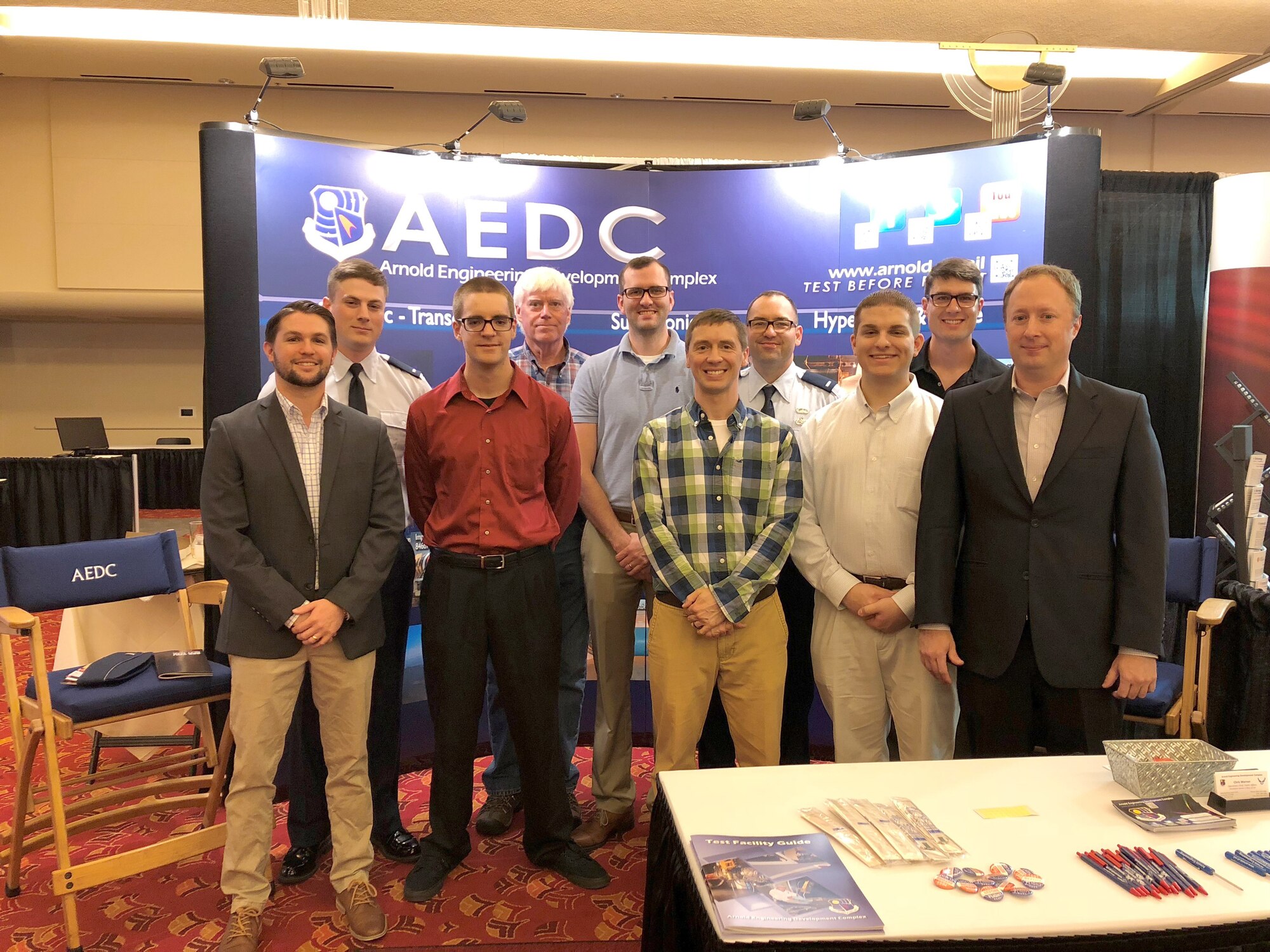 AEDC engineers represent Air Force Materiel Command at the 2018 National Space and Missiles Materiel Symposium held June 25-29 in Madison, Wisconsin. During the weeklong conference, several members of the AEDC team presented papers on the research and development occurring within the Space and Missiles Combined Test Force at Arnold Air Force Base. Pictured left to right: Benjamin Dolmovich, 1st Lt. Thomas Julian, Harry Clark, Bryan Sinkovec, Scott Williams, Jonathan Kodman, 1st Lt. Ryan Boudreaux, Nathan Tendick, Jon Rylan Cox and Edward Marshall Polk. Not pictured is Joseph Sheeley. (U.S. Air Force photo/Christopher Warner)