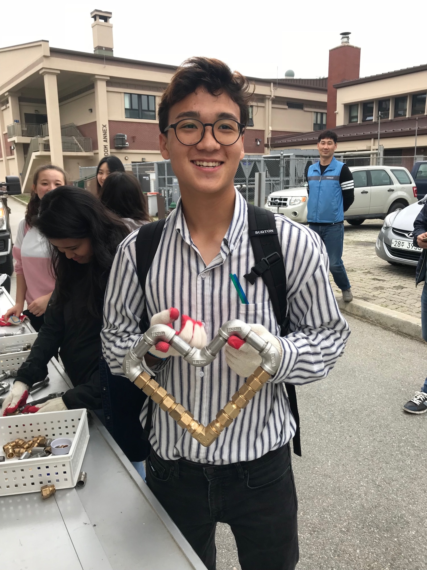 An Osan student participates in a pipe fitting activity during the Science, Technology, Engineering and Mathematics Career Day hosted at Osan Air Base. (Courtesy photo)