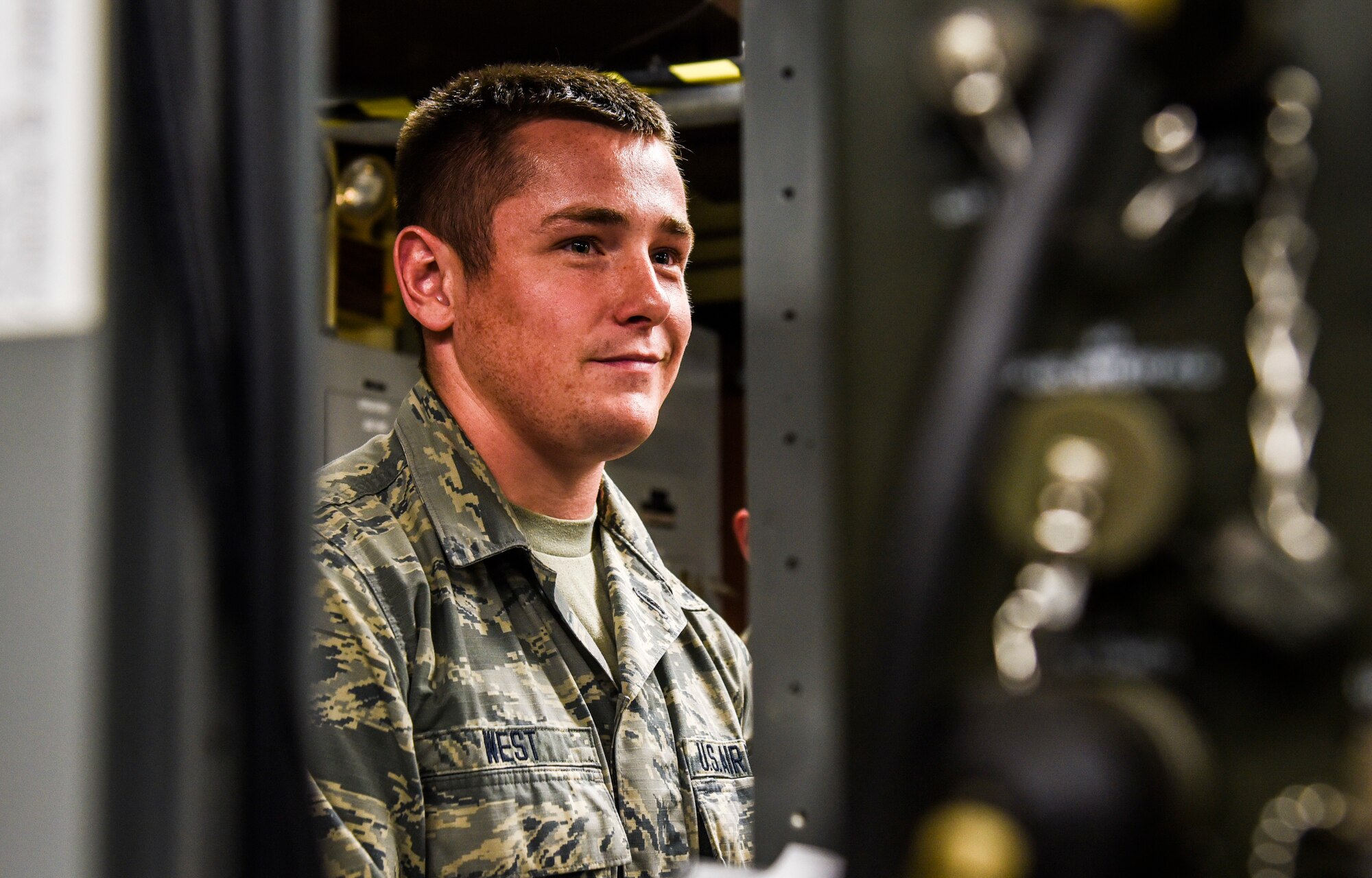 U.S. Air Force Airman 1st Class Randy West, 325th Communications Squadron radio frequency transmission systems apprentice, assesses radio equipment in the RF transmission systems shop at Tyndall Air Force Base, Florida, July 16, 2018.