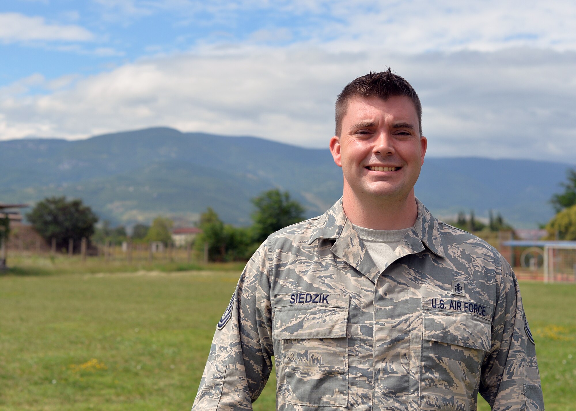 U.S. Air Force Tech. Sgt. Michael Siedzik, 37th Airlift Squadron independent duty medical technician, poses for a photo in Plovdiv, Bulgaria, July 19, 2018. Siedzik deployed with the 37th AS for Thracian Summer 2018, a bilateral exercise between the U.S. and Bulgaria. During the exercise, Siedzik provided medical care for deployed personnel to maintain health and wellness for members to safely and efficiently accomplish their objectives. (U.S. Air Force photo by Staff Sgt. Jimmie D. Pike)