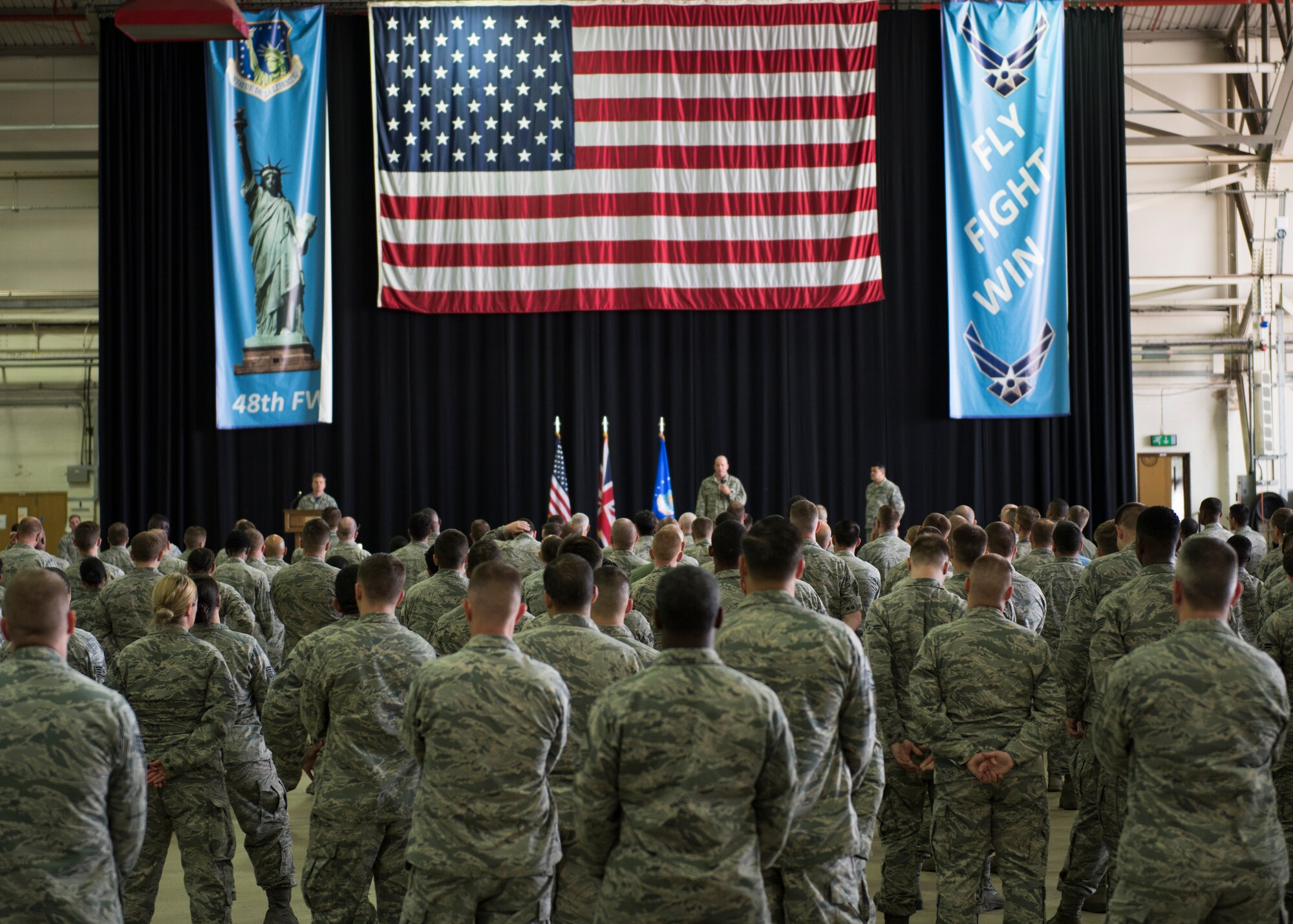 Airmen from the 48th Fighter Wing listen to the Col. William Marshall, 48th FW commander, during an All Call at Royal Air Force Lakenheath, England, July 20, 2018. Marshall emphasized that the wing’s purpose is to generate, equip, train, and sustain combat ready airpower and Airmen, and remain U.S. Air Forces in Europe’s premier combat wing. (U.S. Air Force photo/ Senior Airman Malcolm Mayfield)