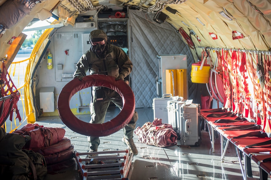 Senior Airman Stetson Vigil, 93rd Air Refueling Squadron boom operator, completes pre-flight tasks during the first in-field use and test of the new Joint Service Aircrew Mask on a KC-135 Stratotanker at Fairchild Air Force Base, Washington, July 17, 2018. The aircrew inspected crucial areas of improvement including comfort, weight, durability, heat stress, function and donning and doffing ease for every flight task. (U.S. Air Force photo/ Airman 1st Class Whitney Laine)