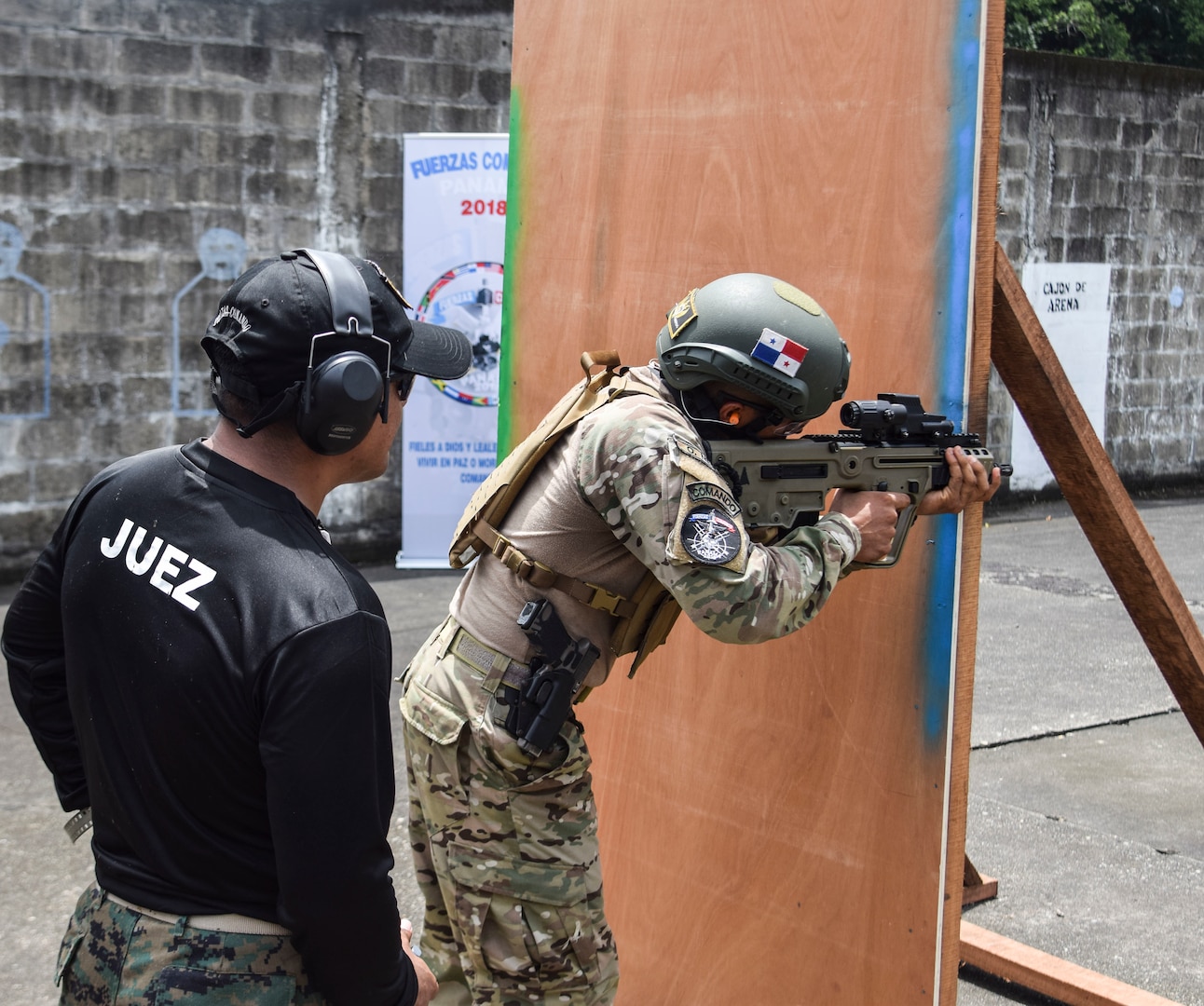 A Panamanian commando takes on an assault on a range during the Fuerzas Comando Competition at the Instituto Superior Policial, Panama, July 18, 2018. Army photo by Staff Sgt. Brian Ragin