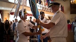 Navy Capt. George Bresnihan (left) receives the Defense Contract Management Agency International flag from Navy Vice Adm. David Lewis, DCMA director, during a change of command ceremony at Fort Lee, Virginia, July 19. Lewis welcomed the incoming commander and bid farewell to former International commander, Navy Capt. Sonya Ebright. (Click next to read more) (DCMA photos by Elizabeth Szoke)