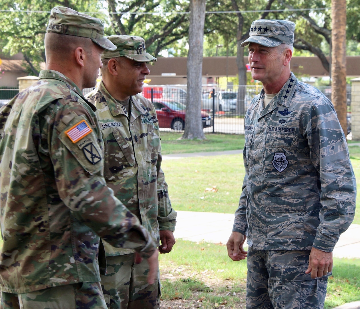 Air Force Gen. Terrence O'Shaughnessy (right), commanding general, North American Aerospace Defense Command and U.S. Northern Command, is greeted by Lt. Gen. Jeffrey Buchanan (left), commanding general, U.S. Army North, and Command Sgt. Maj. Alberto Delgado (center), ARNORTH senior enlisted leader, at Joint Base San Antonio-Fort Sam Houston’s historic Quadrangle during a visit July 17.