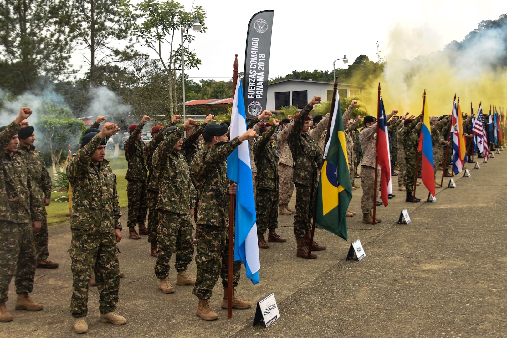 Commandos raise their fists during a ceremony.