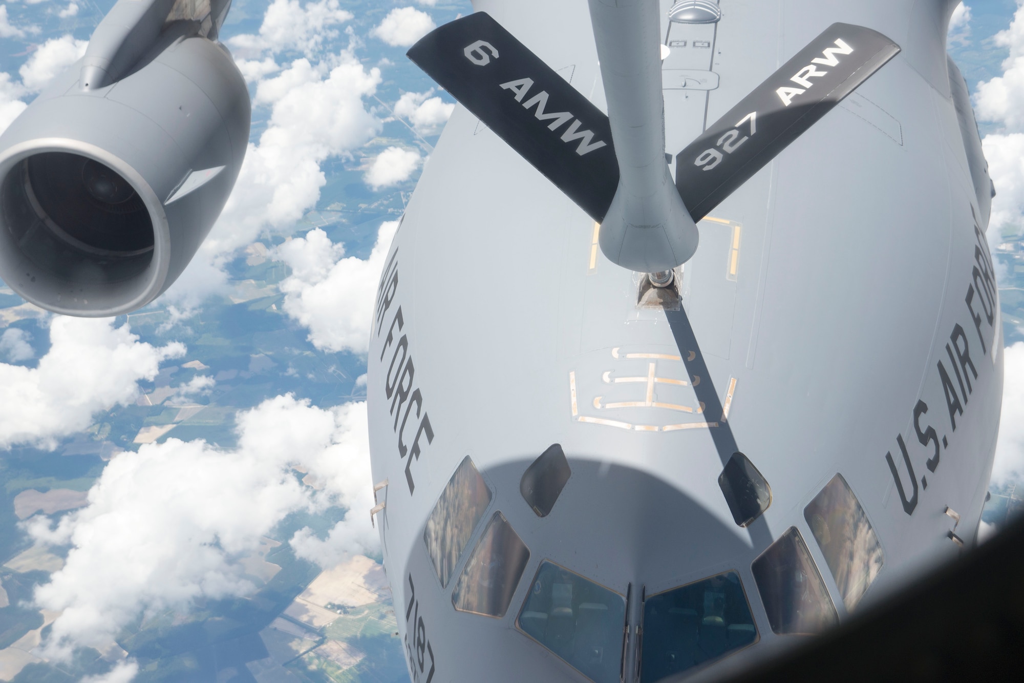 A C-17 Globemaster III aircraft assigned to Joint Base Charleston, South Carolina, receives fuel from a KC-135 Stratotanker aircraft assigned to MacDill Air Force Base, Fla., July 2, 2018.