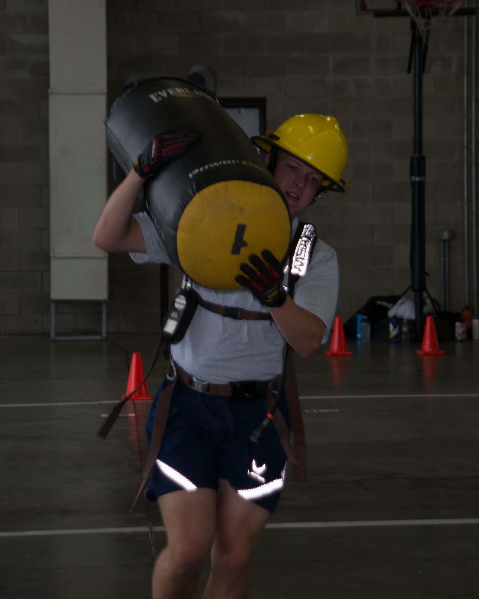 Reserve Officer Training Corps Cadet Matthew McCulla from Air Force ROTC Detachment 595 from North Carolina State University, Raleigh, North Carolina, carries a weighted training bag through an obstacle course at the Crash Fire Station on MacDill Air Force Base, Fla., July 6, 2018.