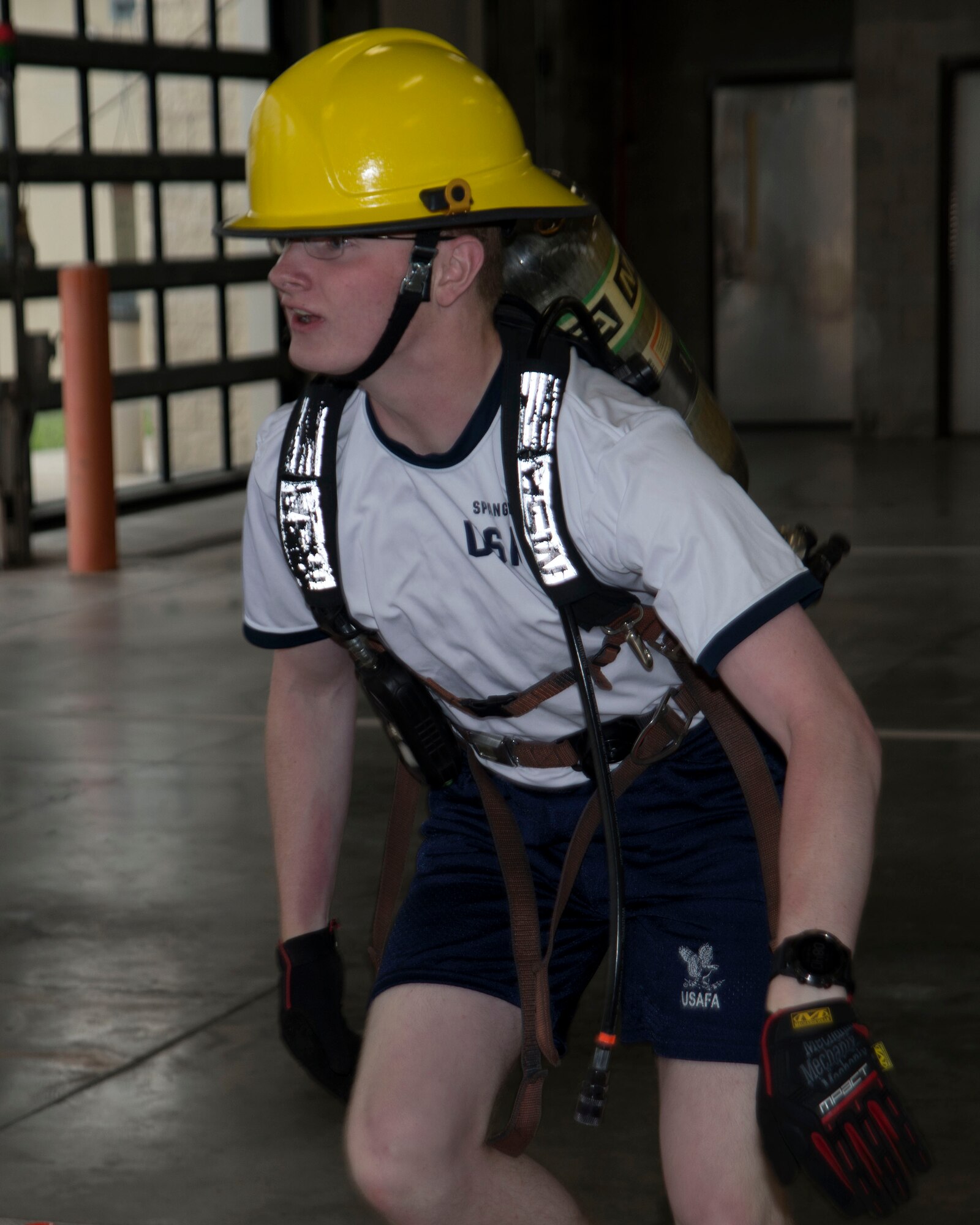 A U.S. Air Force Academy cadet runs through an obstacle course at the Crash Fire Station on MacDill Air Force Base, Fla., July 6, 2018.