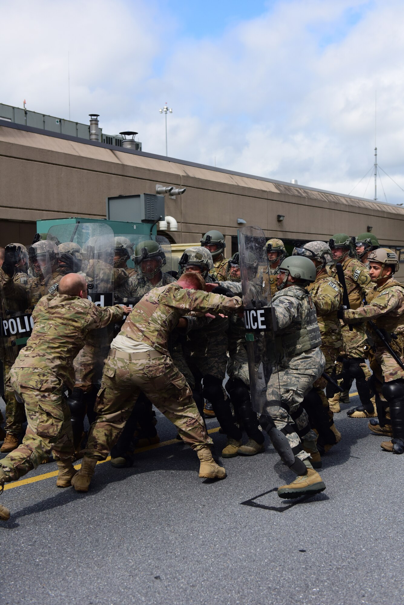 Security forces specialists from the 193rd Special Operations Security Forces Squadron, Middletown, Pennsylvania, Pennsylvania Air National Guard, conduct riot control countermeasures training July 22, 2018. The 193rd SOSFS Airmen participate in this two times a year as part of their required domestic operations training. (U.S. Air National Guard photo by Senior Airman Julia Sorber/Released)
