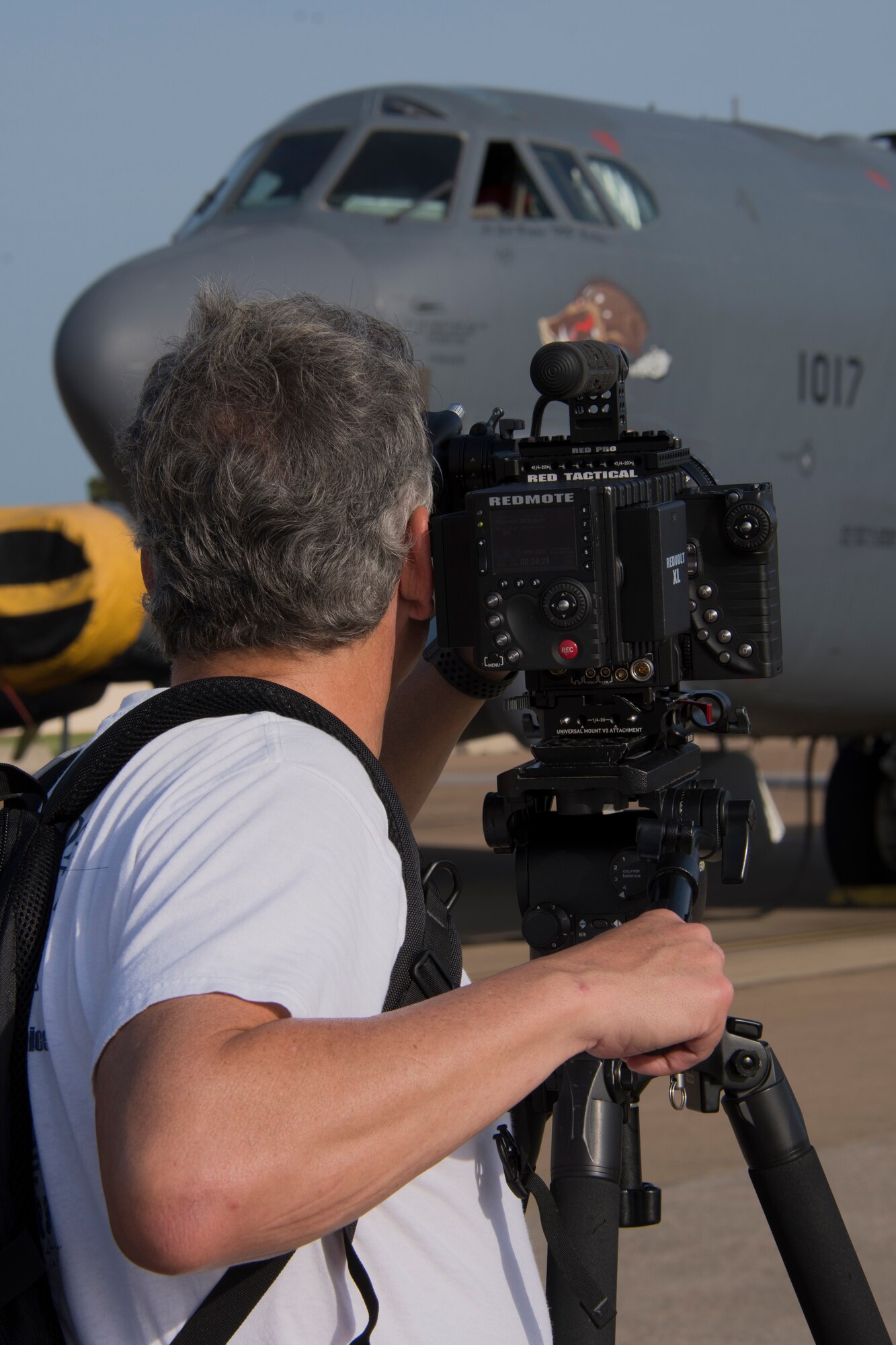 Tom LaRochelle, an advanced media specialist from the Raytheon Company, videos a B-52 Stratofortress at Barksdale Air Force Base, July 20, 2018. LaRochelle and other media specialists from Raytheon were at Barksdale to gather footage of Raytheon's MALD-X missiles being loaded onto the B-52. Airmen of the 307th Aircraft Maintenance Squadron supported the project.  (U.S. Air Force photo by Airman Maxwell Daigle/Released)