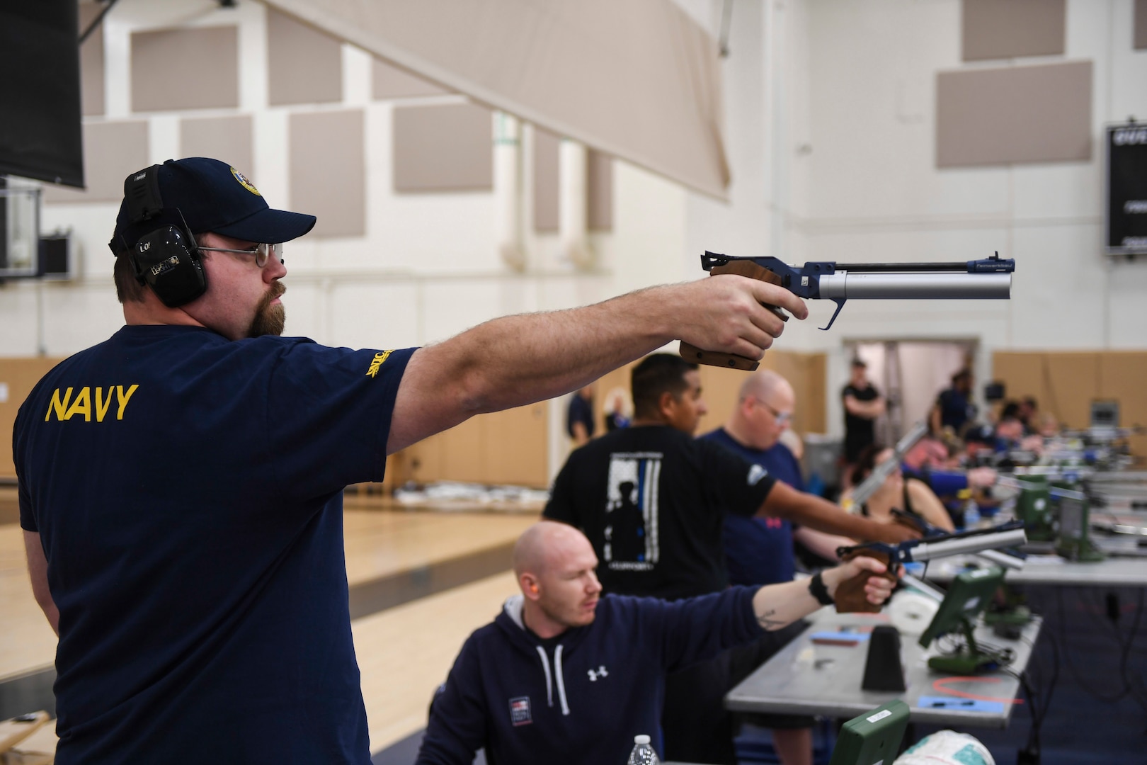 Bill Longworth competes in the shooting portion of the Team Navy Trials at Naval Station (NAVSTA) Mayport's fitness center in preparation for the 2018 Department of Defense Warrior Games