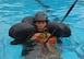 U.S. Air Force Capt. Zoe Kotnik, 55th Fighter Squadron chief of training, simulates being pulled out of water by a rescue helicopter at Shaw Air Force Base, S.C., July 19, 2018.