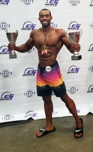 Staff Sgt. Bryan Osorio, 470th Military Intelligence Brigade counterintelligence special agent, holds the two first-place trophies he won while competing at the Europa Games bodybuilding competition in Dallas June 16-17. Osorio finished first in his class in the open category and first in the novice category.
