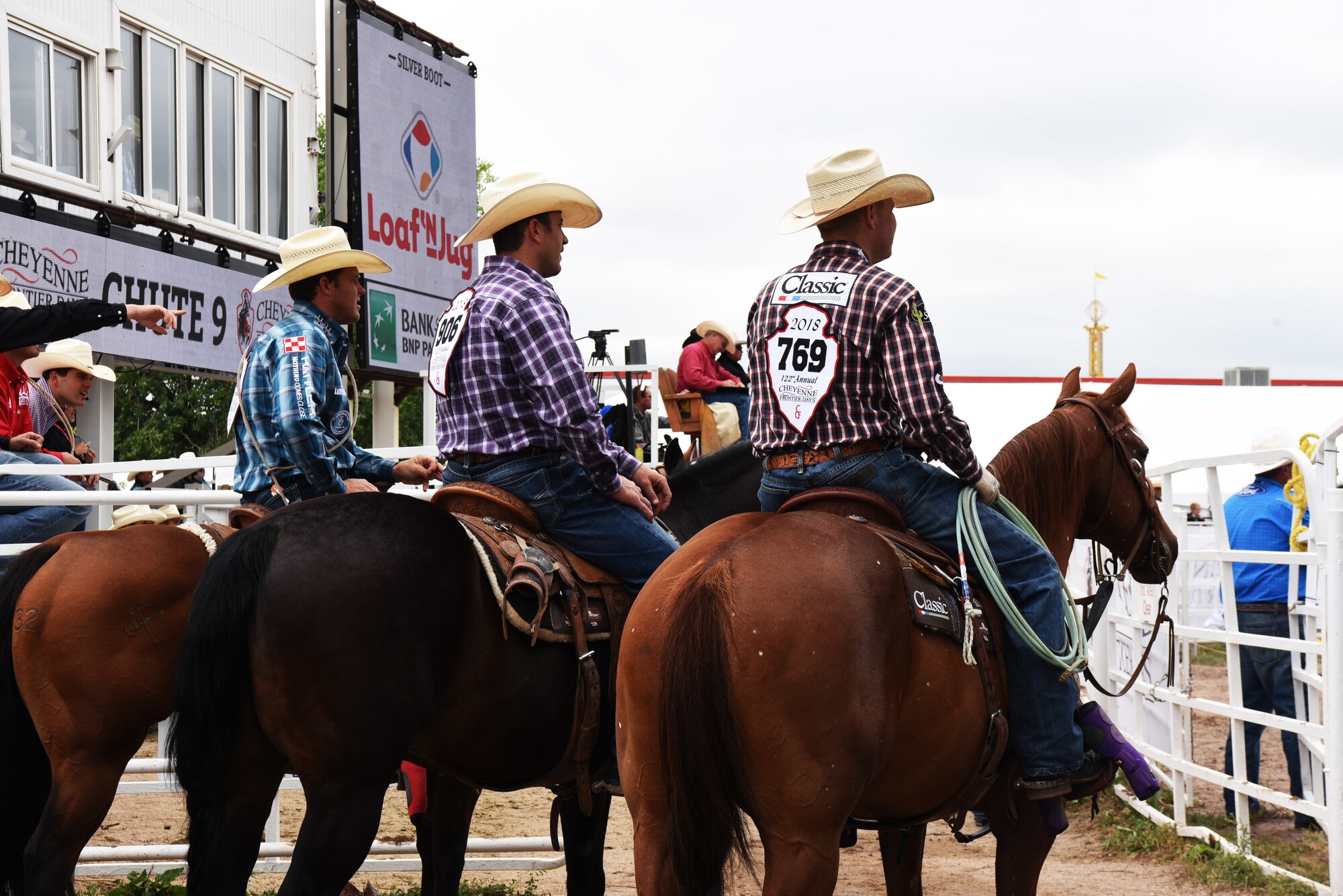 Rodeo participants watch some of the Military Monday events during Cheyenne Frontier Days at Frontier Park in Cheyenne, Wyo., July 23, 2018. CFD is Cheyenne’s biggest annual event with thousands of visitors taking part. The base and Cheyenne communities came together to celebrate the CFD rodeo and festival. (U.S. Air Force photo by Senior Airman Breanna Carter)