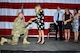 Chief Master Sgt. Robert Bean, USAF (ret.), presents his wife Jenny with a diamond ring during his retirement ceremony July 20 here. Bean, who served his final tour at Kirtland as the Commandant of the 351st Battlefield Airmen Training Squadron, also arranged for he and his wife to renew their vows on the spot during the ceremony. His children (left to right) Corey, Cailey and Christina witnessed the surprise proposal. He was showered with accolades from his Pararescue comrades and a grateful Air Force. (U.S. Air Force photo by Todd Berenger)