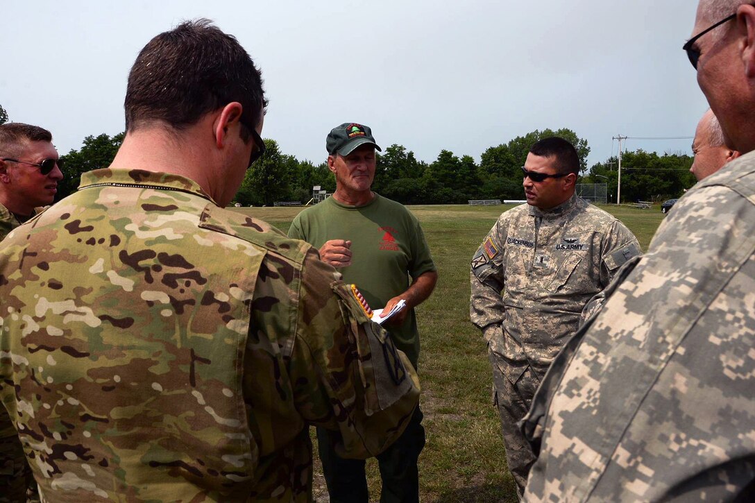 Soldiers receive a safety and mission brief before fighting a forest fire.
