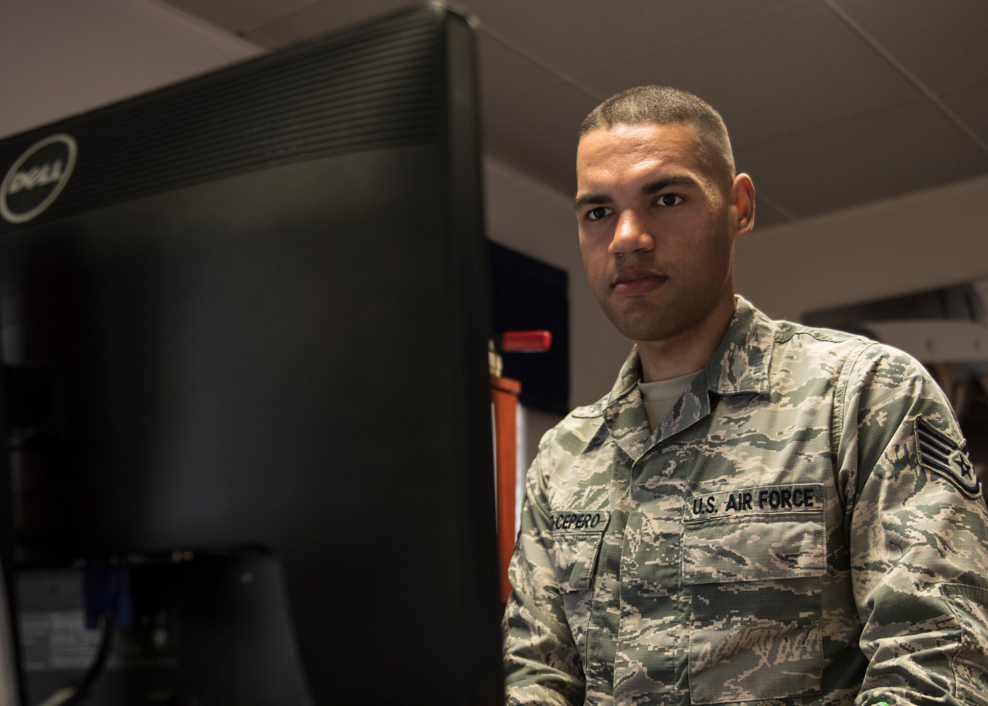 INCIRLIK AIR BASE, Turkey – U.S. Air Force Staff Sgt. Bryant Lopez-Cepero, 728th Air Mobility Squadron unit training manager, works at his computer at Incirlik Air Base, Turkey, July 5, 2018.