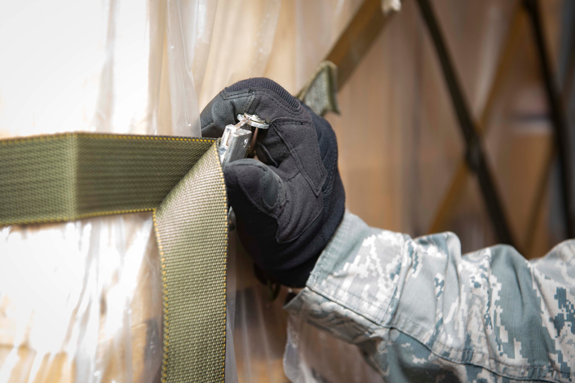 U.S. Air Force Staff Sgt. Brandon Mabee, 721st Aerial Port Squadron Ramp Services supervisor, guides cargo off a Boeing 747 aircraft on Ramstein Air Base, Germany, July 18, 2018. The 721st APS is dedicated to ensuring the safe transfer of cargo in and out of Ramstein, which supports personnel in deployed locations with food, water, and supplies. (U.S. Air Force photo by Senior Airman Elizabeth Baker)