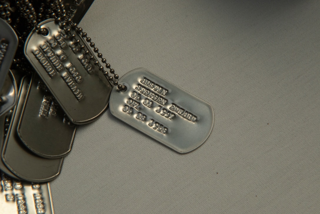 Cpl. Stephen E. Austin's dog tags lay alongside the dog tags of his fellow 1st Battalion, 27th Marine Regiment Marines July 21 at the 50th anniversary reunion in Alexandria, Va. Austin was killed in 1968 while serving as a squad leader with 1st Battalion, 27th Marines in Vietnam. Austin was killed when he sacrificed himself and exposed himself to enemy fire.