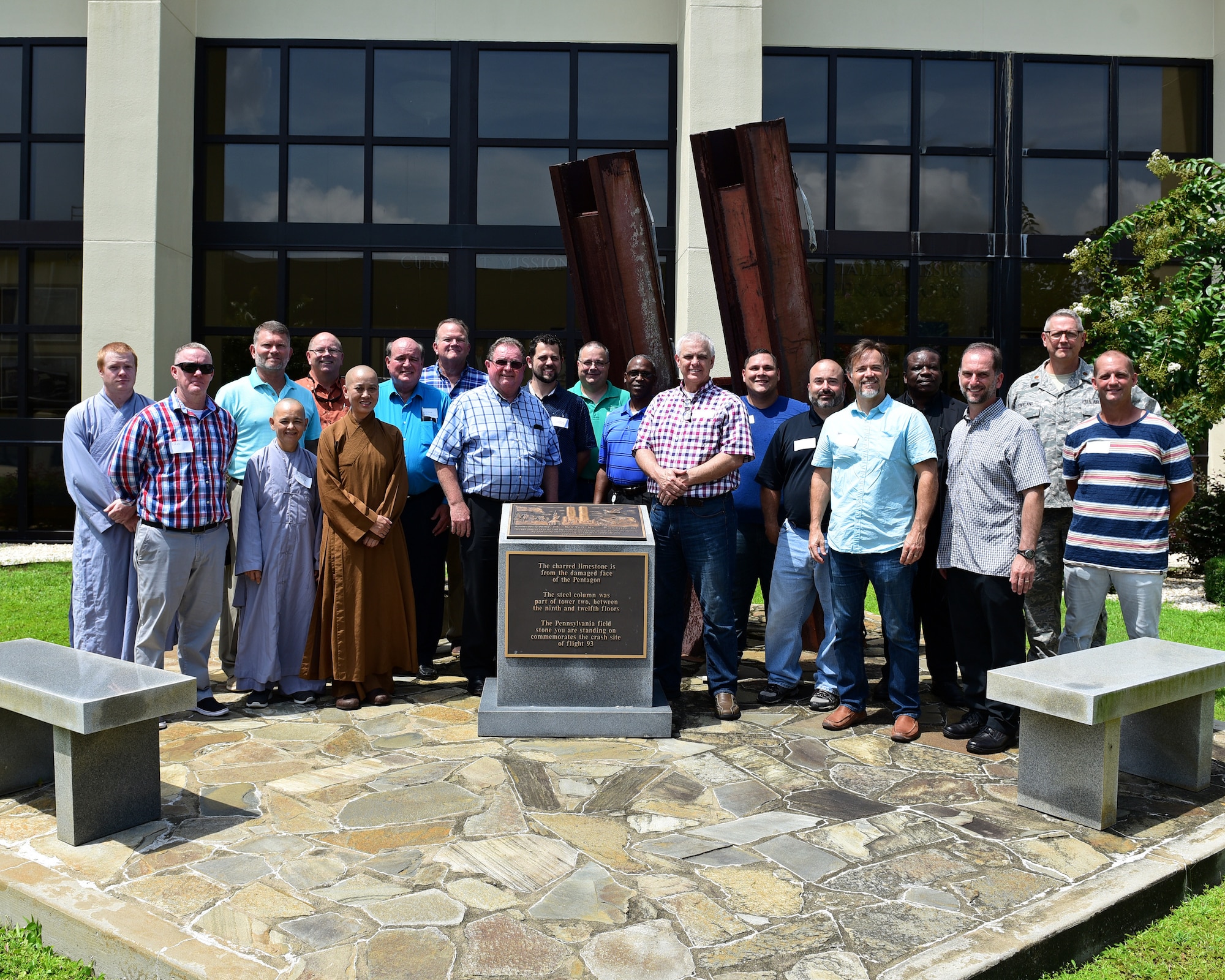 Clergy members from the local community pose for a photo at the 601st Air Operations Center 9/11 Memorial.