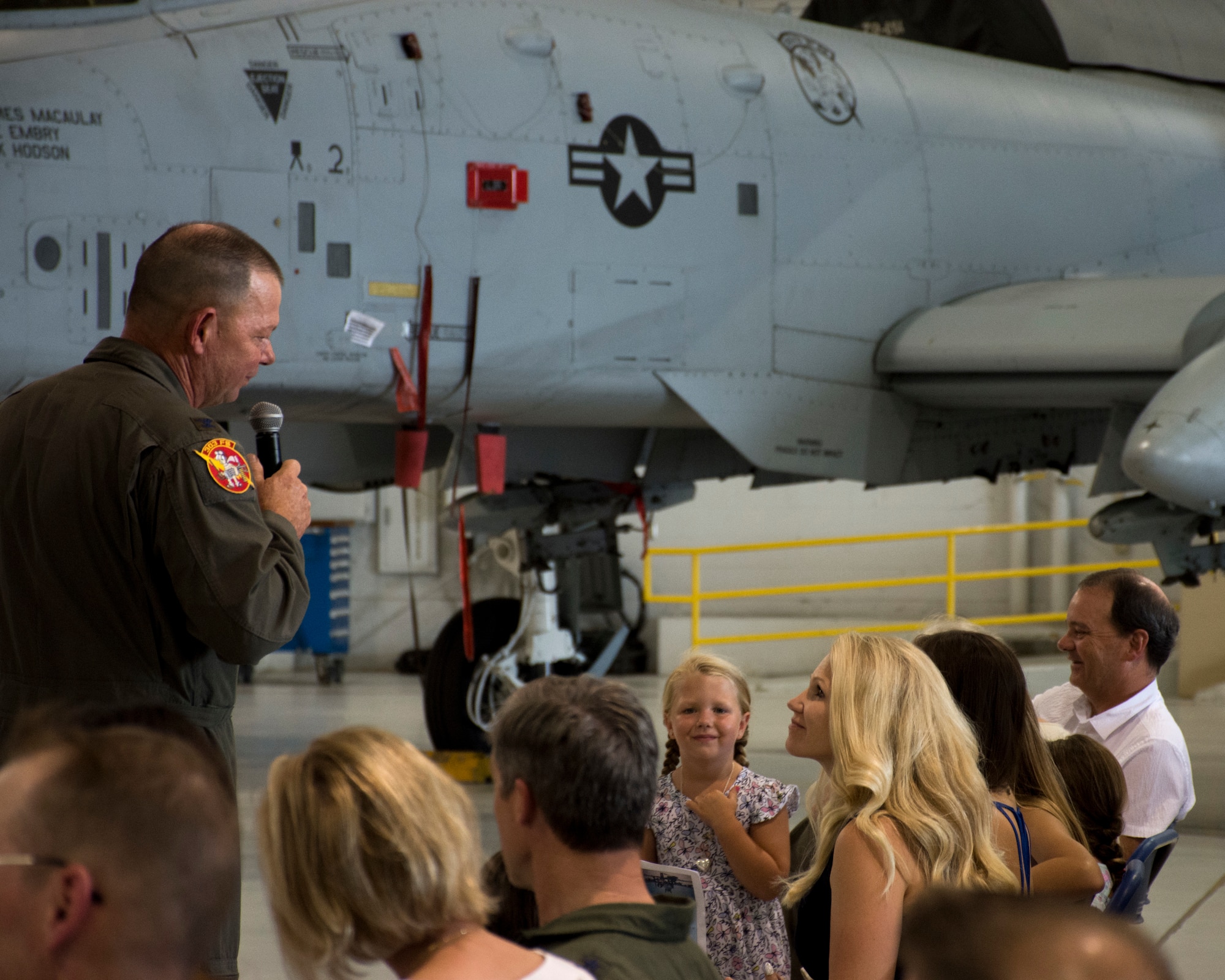 Col. Jim Macaulay addresses his wife, Kris, at his retirement ceremony.