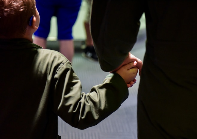 Caleb Pettit, 9, walks through the 15th Airlift Squadron with Capt. Bradley States, 437th Airlift Wing pilot, July 20, 2018, at Joint Base Charleston, S.C.