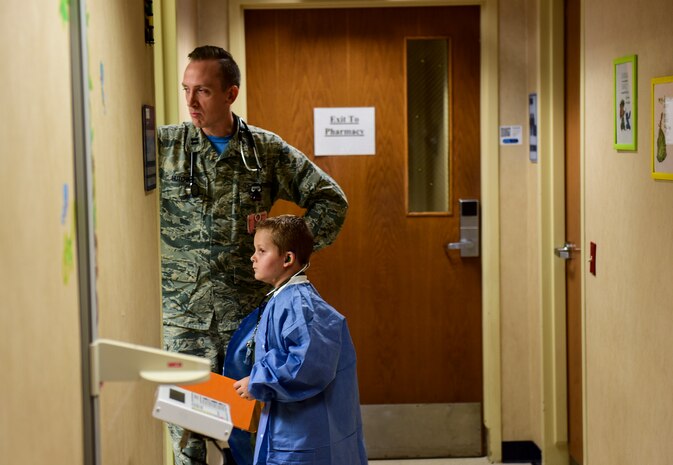 Caleb Pettit, 9, looks into the examination room while playing doctor, July 20, 2018, at Joint Base Charleston, S.C.