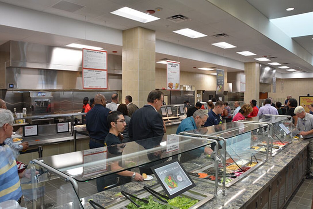 Employees sample free salad bar at soft opening of Center Restaurant July 23, 2018.