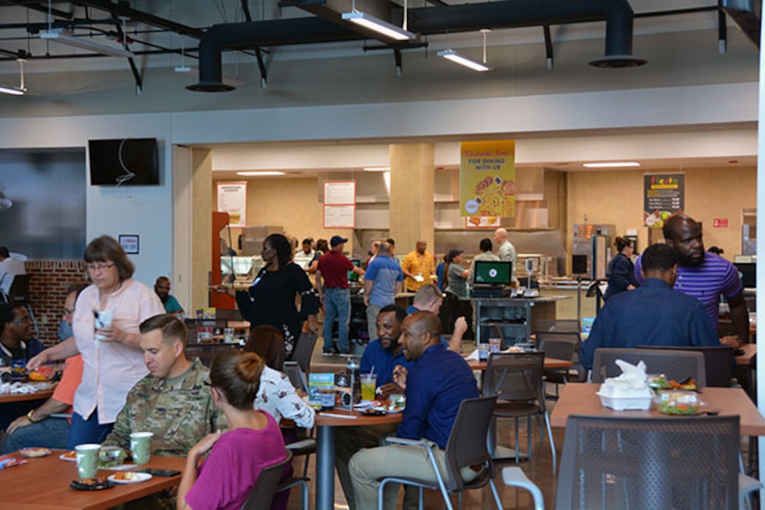 Employees enjoy free food samples at soft opening of Center Restaurant July 23, 2018.