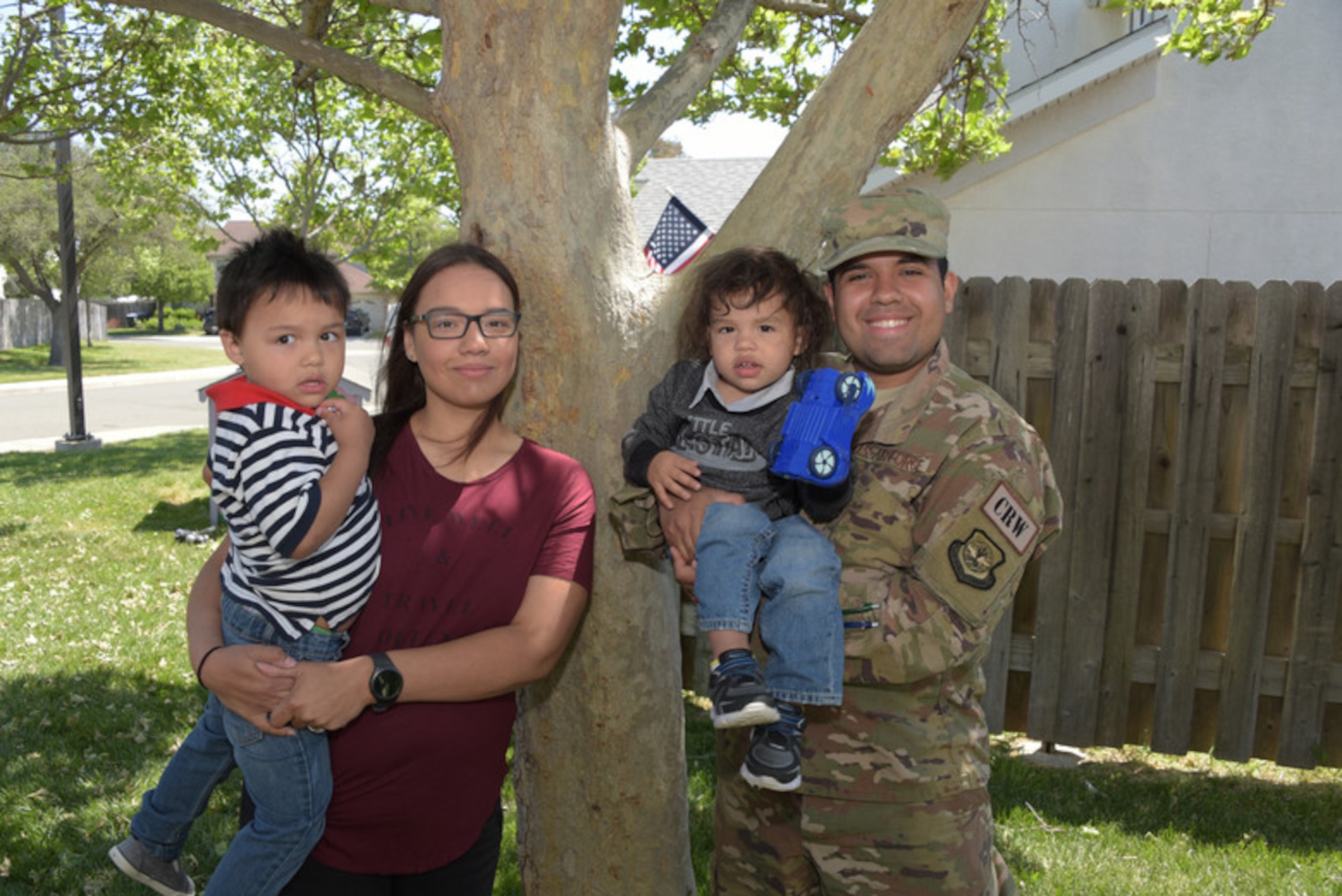 Savannah Ruiz (Left) and her husband, Senior Airman Ruben Ruiz (Right), 921st Contingency Response Squadron aerial porter, pose for a photo with their children outside their home at Travis Air Force Base, Calif., April 26, 2018.(U.S. Air Force photo by Tech. Sgt. James Hodgman)