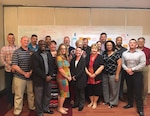 Eighteen Performance Improvement Officers, also known as PIOs, graduated from the Defense Contract Management Agency’s one-week green belt training on May 25. The training will help employees lead teams to update business processes across the agency. (DCMA photo by Andrew Miskovich)
