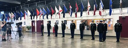 Soldiers of the New York Army National Guard's 42nd Infantry Division go through a uniform inspection under the watchful eyes of local TV crews at the New York State Armory in Troy, N.Y. on Sunday, July 22, as they prepared to fly to France to participate in World War I commemorative events.