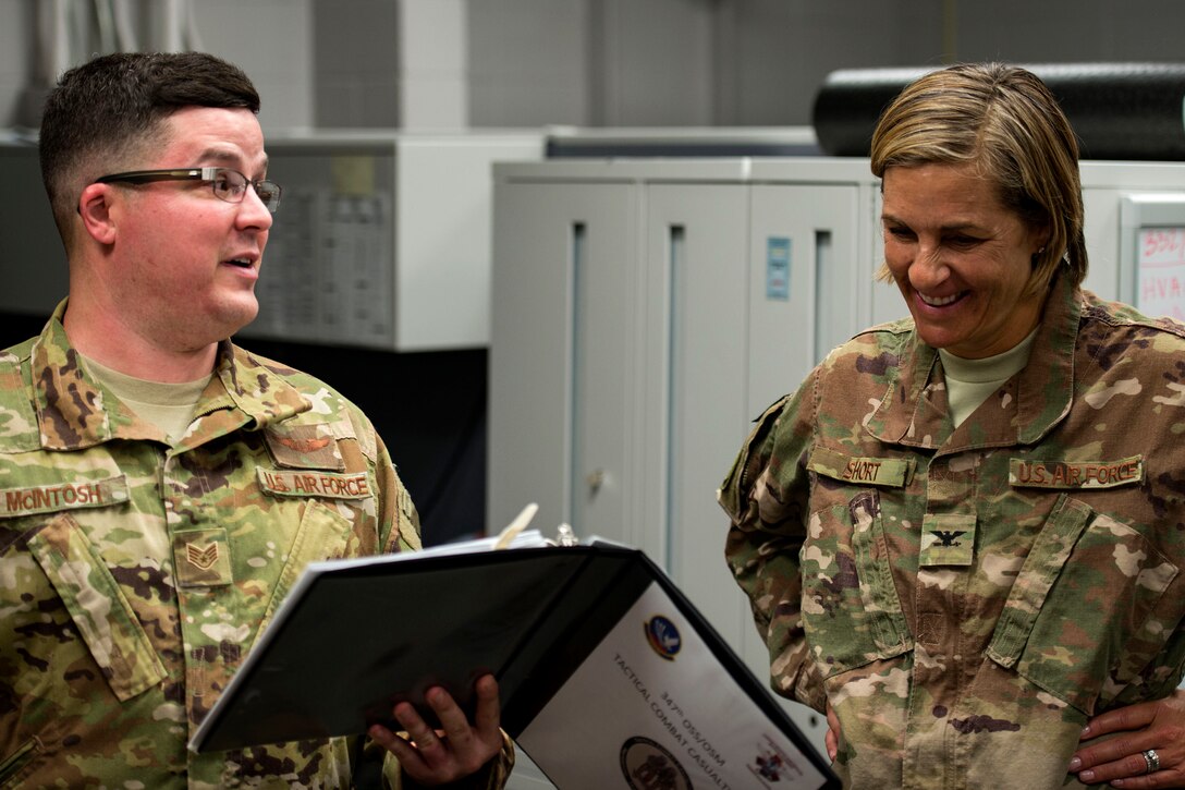 Staff Sgt. Andrew McIntosh, left, 347th Rescue Group training manager, briefs Col. Jennifer Short, 23d Wing commander, prior to a simulated exercise during an immersion tour, July 23, 2018, at Moody Air Force Base, Ga. During the immersion, Short visited with Survival, Evasion, Resistance, Escape (SERE) and medical specialists from the 347th Operations Support Squadron (OSS). The 347th OSS rescue training center houses both independent duty medical technician paramedics and SERE specialists, whose mission is to train and equip Airmen to be able to survive and save lives while in austere environments. (U.S. Air Force photo by Airman 1st Class Erick Requadt)