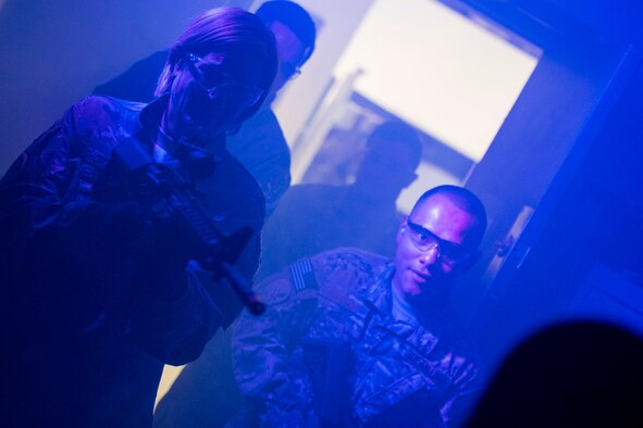 Col. Jennifer Short, left, 23d Wing commander, participates in close-quarter combat with Airmen from the 347th Operations Support Squadron (OSS) during an immersion tour, July 23, 2018, at Moody Air Force Base, Ga. During the immersion, Short visited with Survival, Evasion, Resistance, Escape (SERE) and medical specialists from the 347th OSS. The 347th OSS rescue training center houses both independent duty medical technician paramedics and SERE specialists, whose mission is to train and equip Airmen to be able to survive and save lives while in austere environments. (U.S. Air Force photo by Airman 1st Class Erick Requadt)