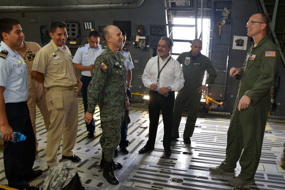 Master Sgt. Marcus Wasden, 356th Airlift Squadron C-5M Super Galaxy loadmaster, talks with students from the Inter-American Air Forces Academy July 18 at Joint Base San Antonio-Lackland. Wasden, a loadmaster instructor, explained how a winch under the cargo floor can pull cargo onto the aircraft.