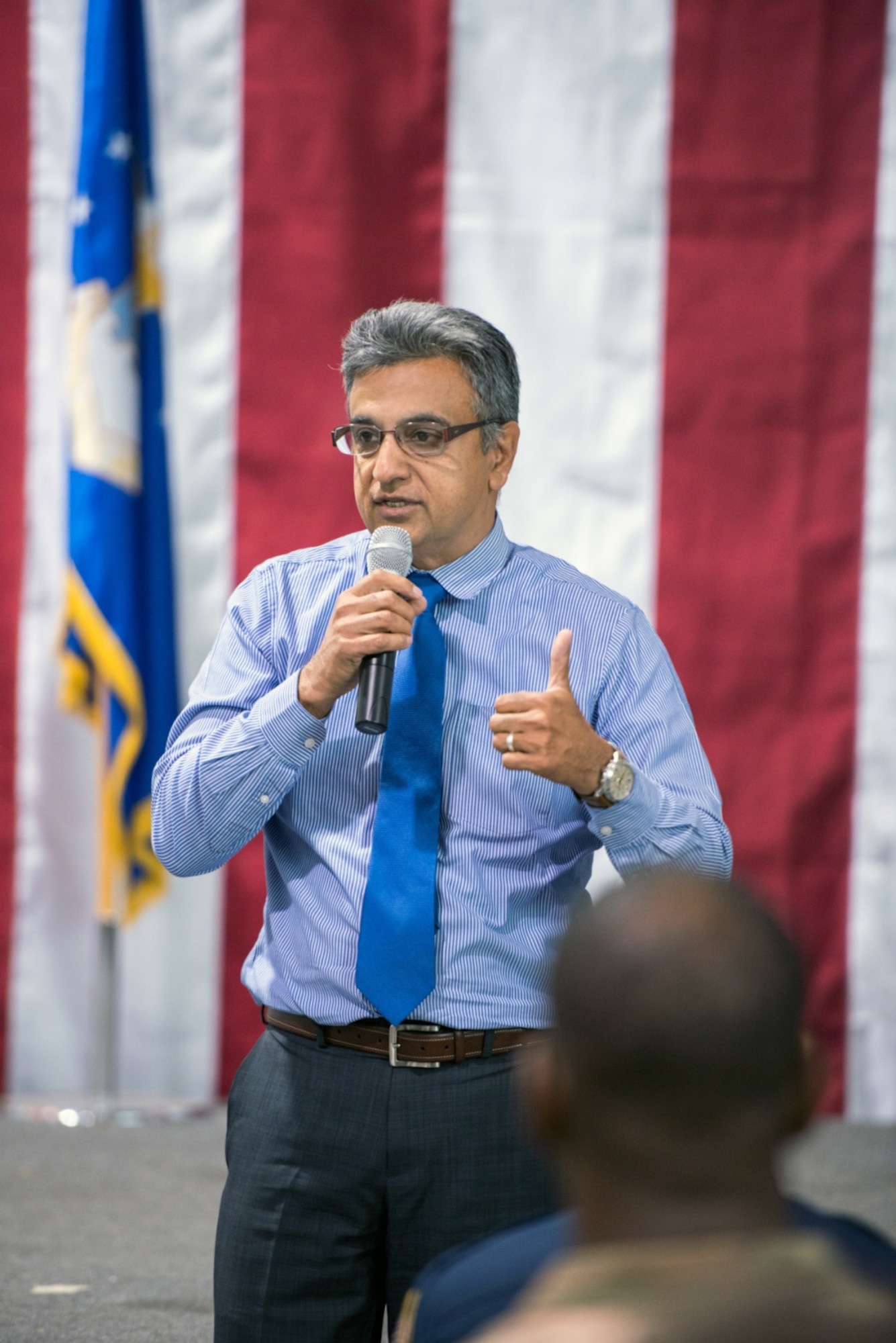 Mustak Keval from the 60th Force Support Squadron, provides remarks during a Town Hall meeting for family and service members of the 621st Contingency Response Wing at Travis Air Force Base, Calif., Oct. 16, 2017. During this meeting, representatives from the local community and the base provided updates about the ongoing wildfires in Northern Calif., support services available for families, and current hurricane relief assistance in the U.S. and Caribbean. (U.S. Air Force photo by Louis Briscese)